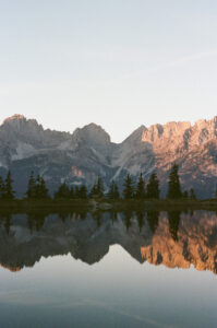 Sunset at Lake Astbergsee in Tyrol with water reflections