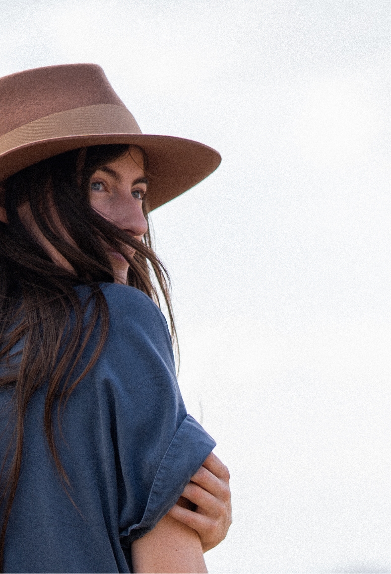Portrait of photographer Caro, daydreaming and looking into nature