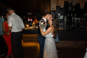 Bride and groom share a private kiss