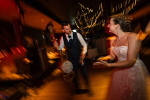 Motion blur photo of the wedding couple dancing with the instrument