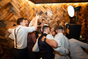Side view of the photo booth crowded with guests