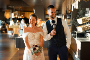 Bride and groom giving a speech to their guests