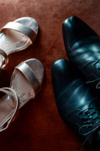 Detail shot of the bride’s and groom’s wedding shoes photographed from above