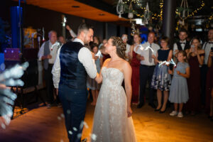 Wedding dance of the bride and groom, smiling at each other with joy