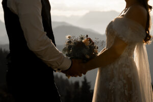 Close-up of the wedding bouquet held by the bride and groom