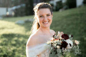 Portrait of the bride smiling brightly at the camera
