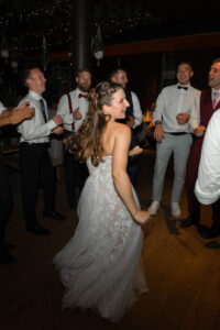 Dancing bride on the dance floor in front of the guests