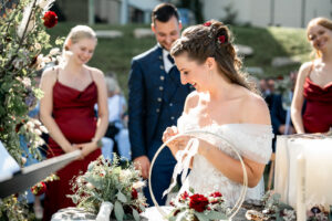 Close-up of the bride receiving her wedding ring