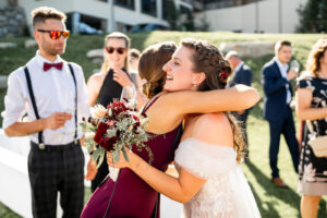 The bride warmly embraces a friend