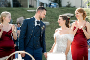 Bride and groom looking at each other lovingly after the kiss