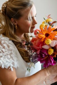 Close-up of the bride smelling her bouquet