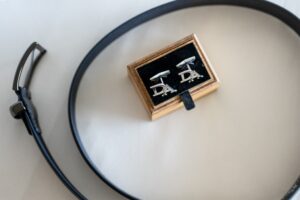Close-up of cufflinks engraved with initials