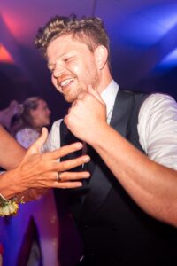Portrait of the groom enjoying the wedding celebration