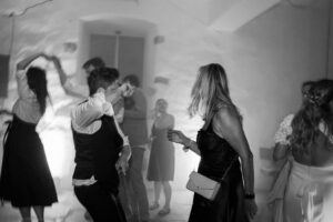 Black and white photo of guests celebrating on the dance floor