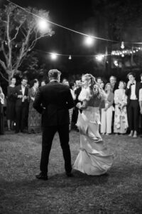 Black and white photo of the couple's first dance photographed from behind