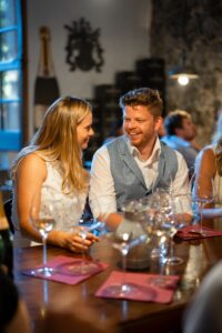 Bride and groom leaning their heads together and laughing affectionately at each other