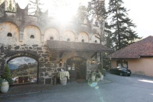 Golden sunset light shines over the vinotheque of Castle Rametz, bathing the scene in warm colors