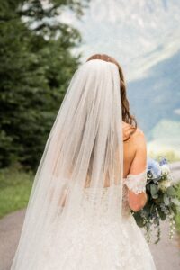 Close-up from behind of the bride and her veil