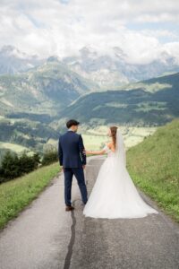 First look of a bride and groom turning toward each other