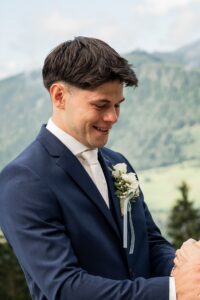 Close-up of the groom’s face with a tear running down his cheek