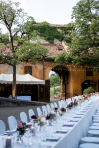 Close-up of the white reception table with terracotta walls behind