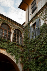 Castle architecture photographed from the courtyard with ivy-covered walls