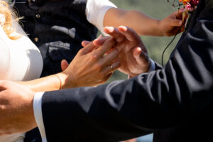 Close-up of hands during the wedding ring exchange