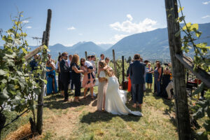Wide-angle photo of the first congratulations after the ceremony