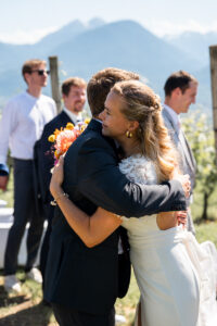 The bride receives a heartfelt hug from a guest
