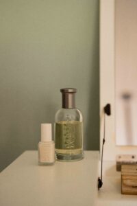 Close-up of BOSS perfume and nail polish on the makeup table