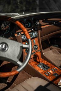 Detail photo of the steering wheel and interior of a vintage Mercedes