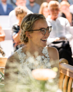 Close-up of the bride laughing during the ceremony