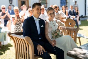 Heartfelt moment during the ceremony with the wedding couple laughing