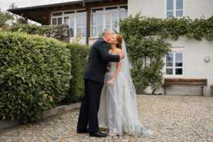 Warm embrace between the bride and her father before the ceremony