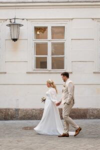 Vintage motion blur photo of a wedding couple walking through the old town
