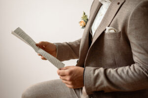 Side close-up of hands holding the love letter