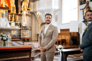 The groom turns around in the church and sees his bride for the first time
