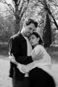 Editorial-style vintage black-and-white photo of a couple embracing