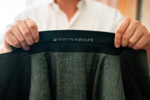 Close-up of the suit collar embroidered with coordinates