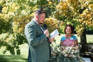 The groom reads his wedding vows