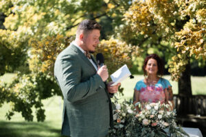 The groom reads his wedding vows