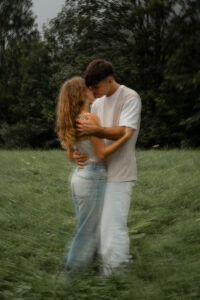 Intimate embrace of a young couple with motion blur just before a kiss