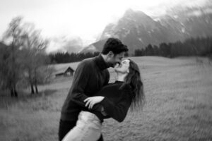 Black-and-white photo of a dip in a field with circular motion blur