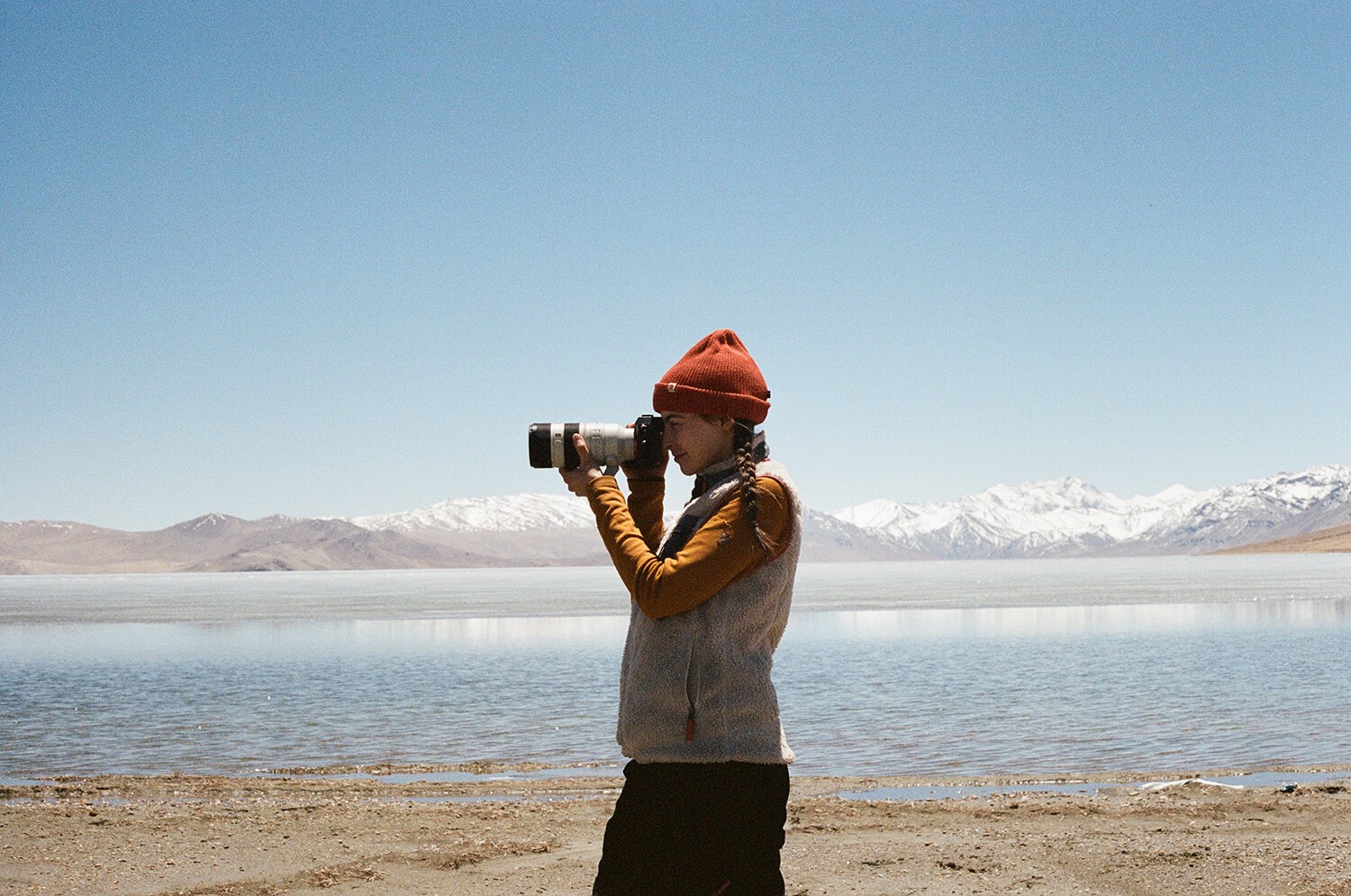 Portrait of photographer Caro working in a high alpine region of the Himalayas