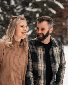 Grainy photo of a couple laughing joyfully into nature